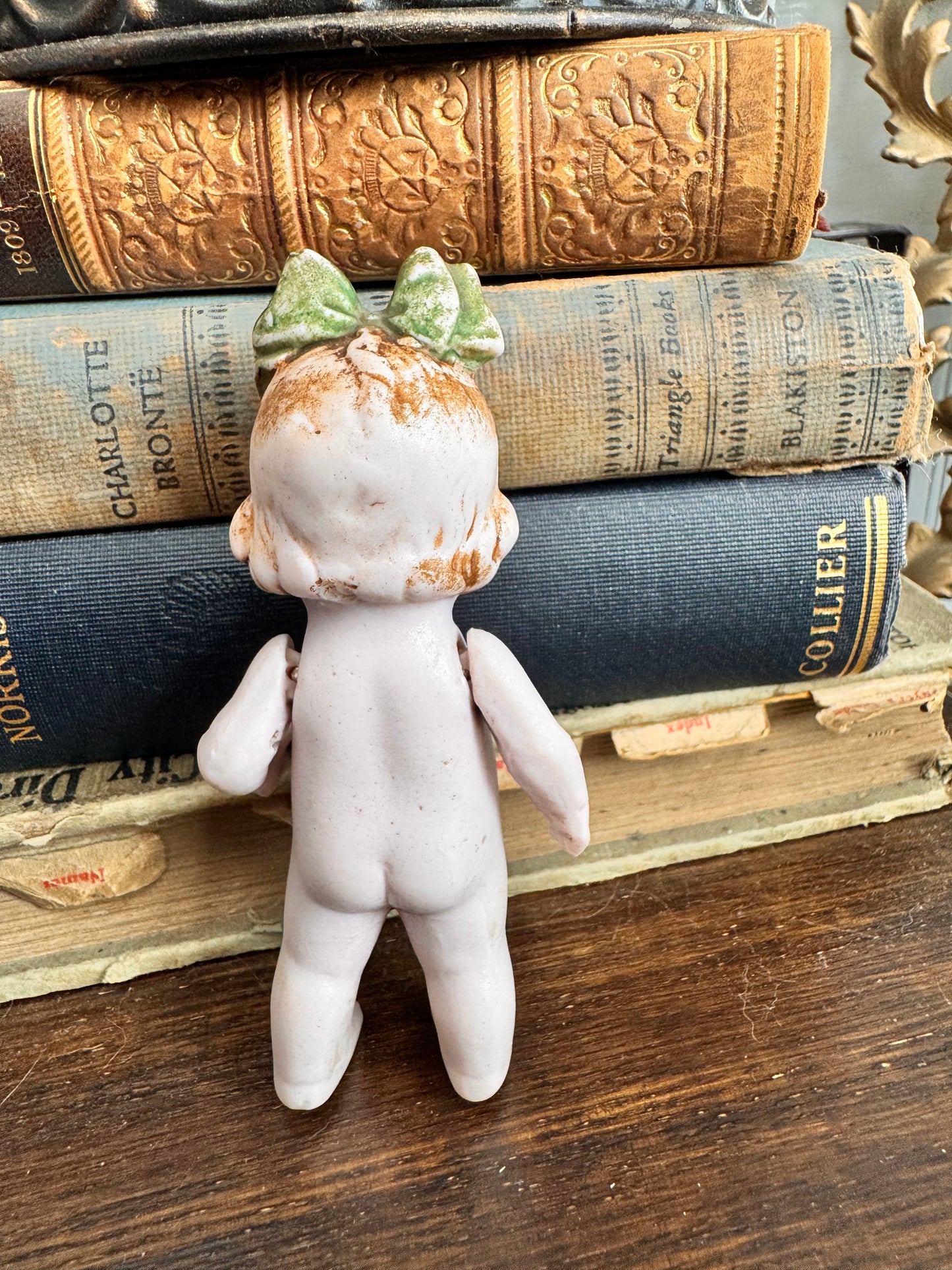 Bisque Doll with Green Bow