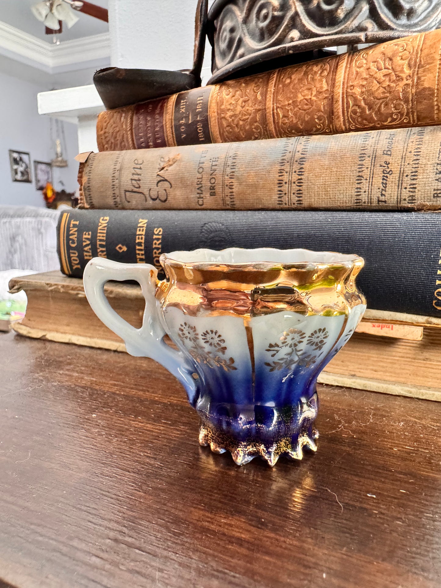 Vintage German Porcelain Demitasse Cup with Gold Floral Detailing.