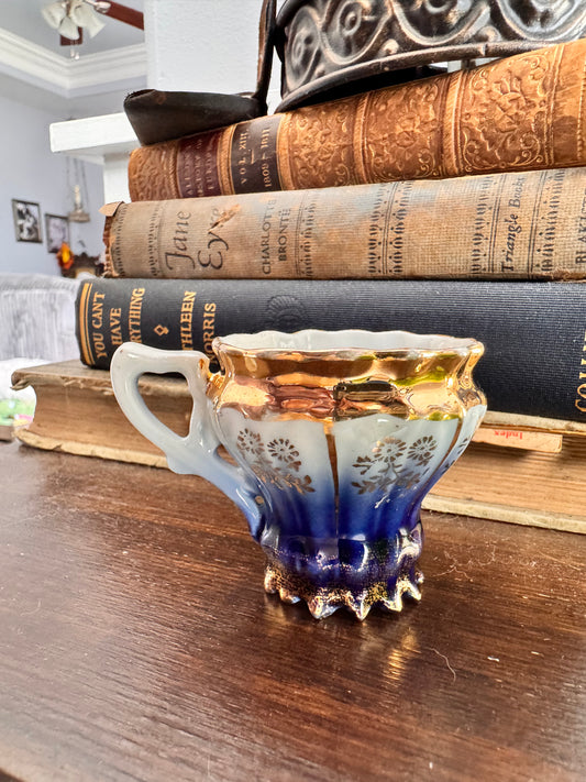 Vintage German Porcelain Demitasse Cup with Gold Floral Detailing.