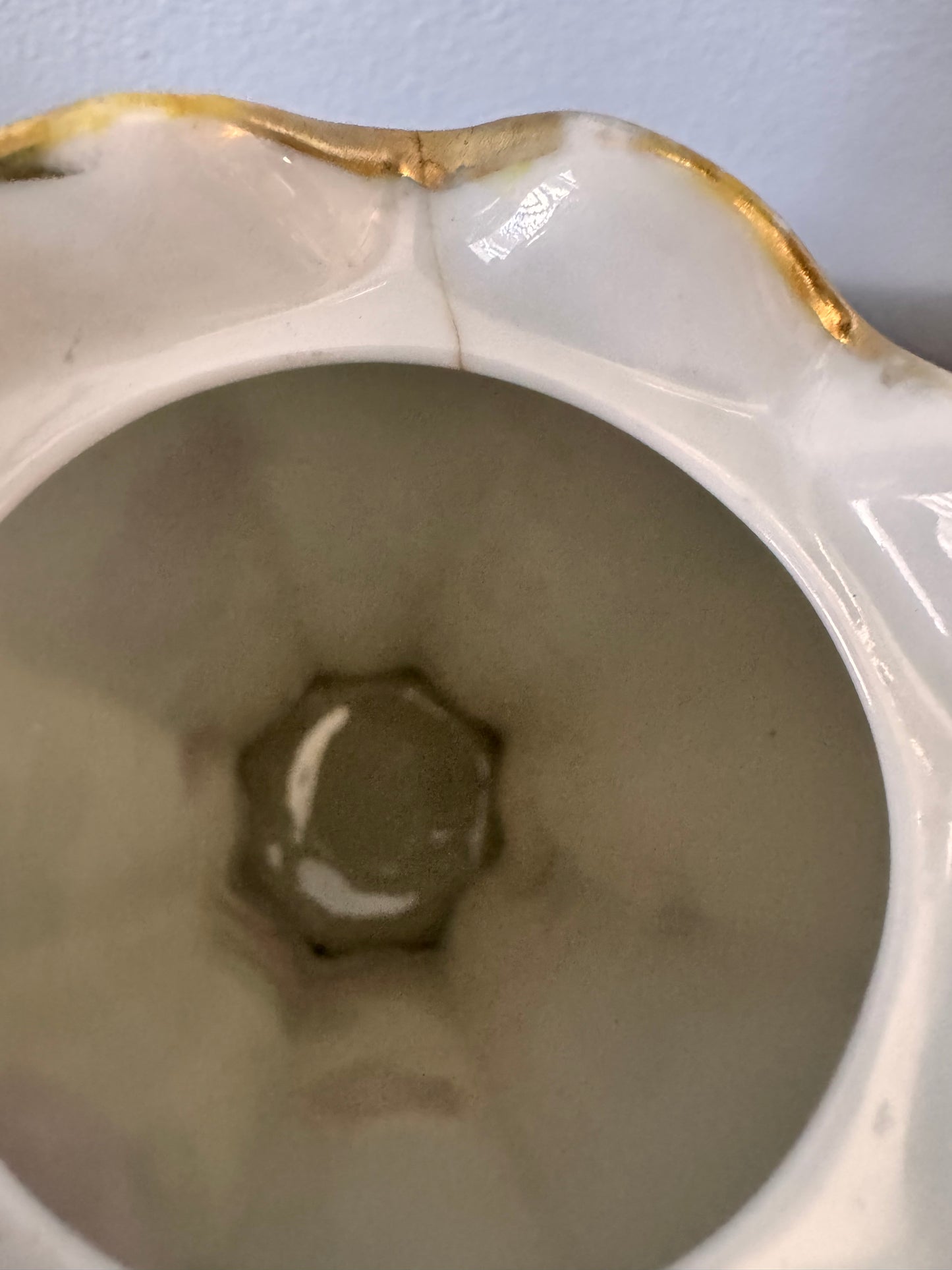 Hand-painted Nippon porcelain chocolate pot and saucer with raised gold detailing.