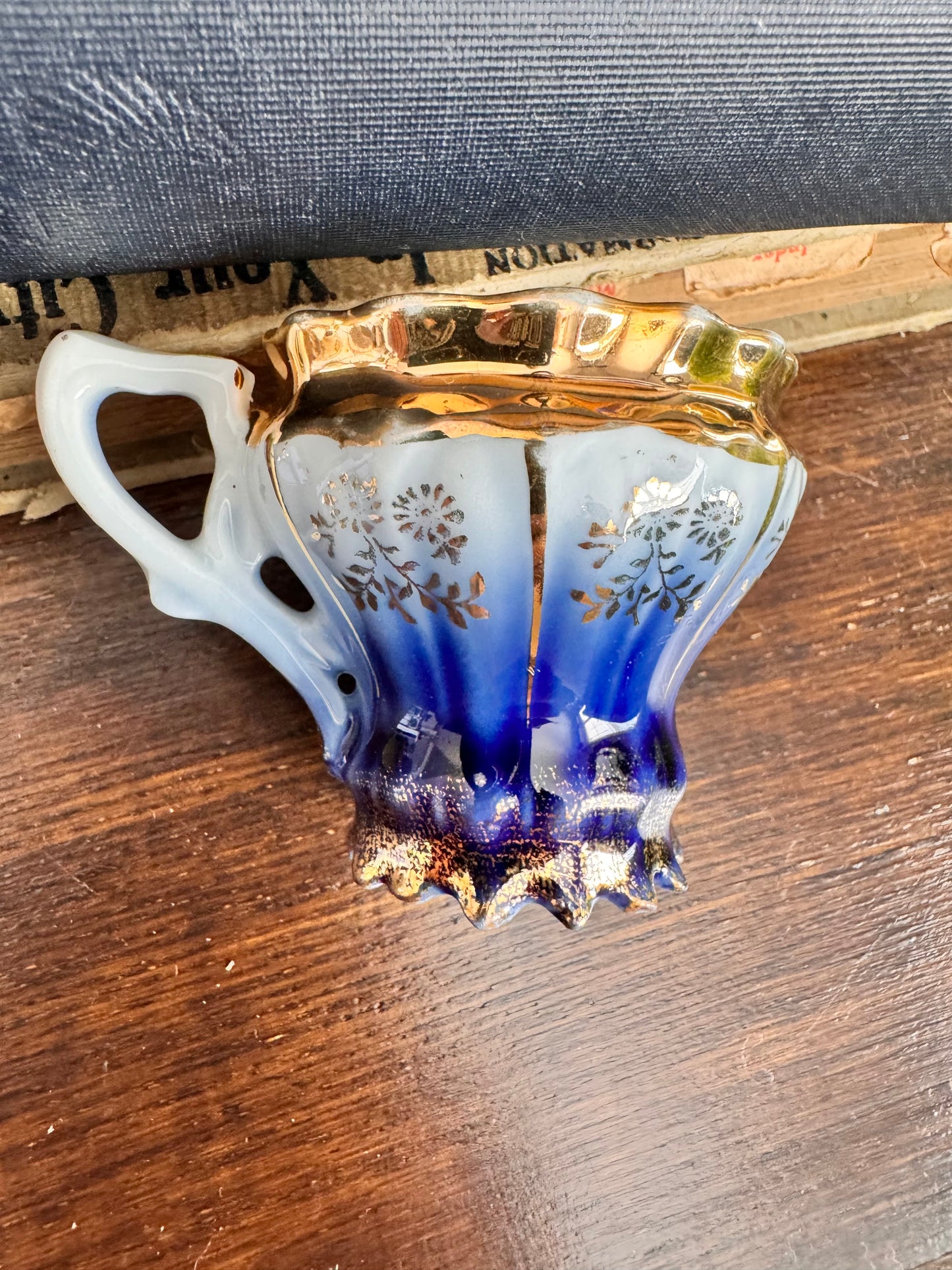 Vintage German Porcelain Demitasse Cup with Gold Floral Detailing.