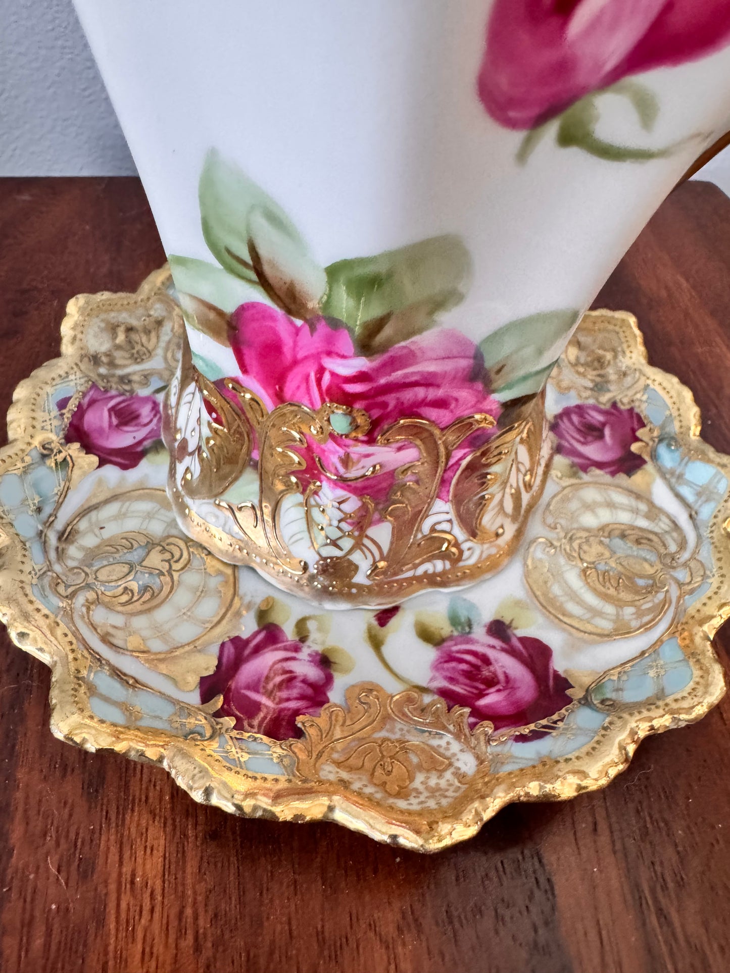 Hand-painted Nippon porcelain chocolate pot and saucer with raised gold detailing.