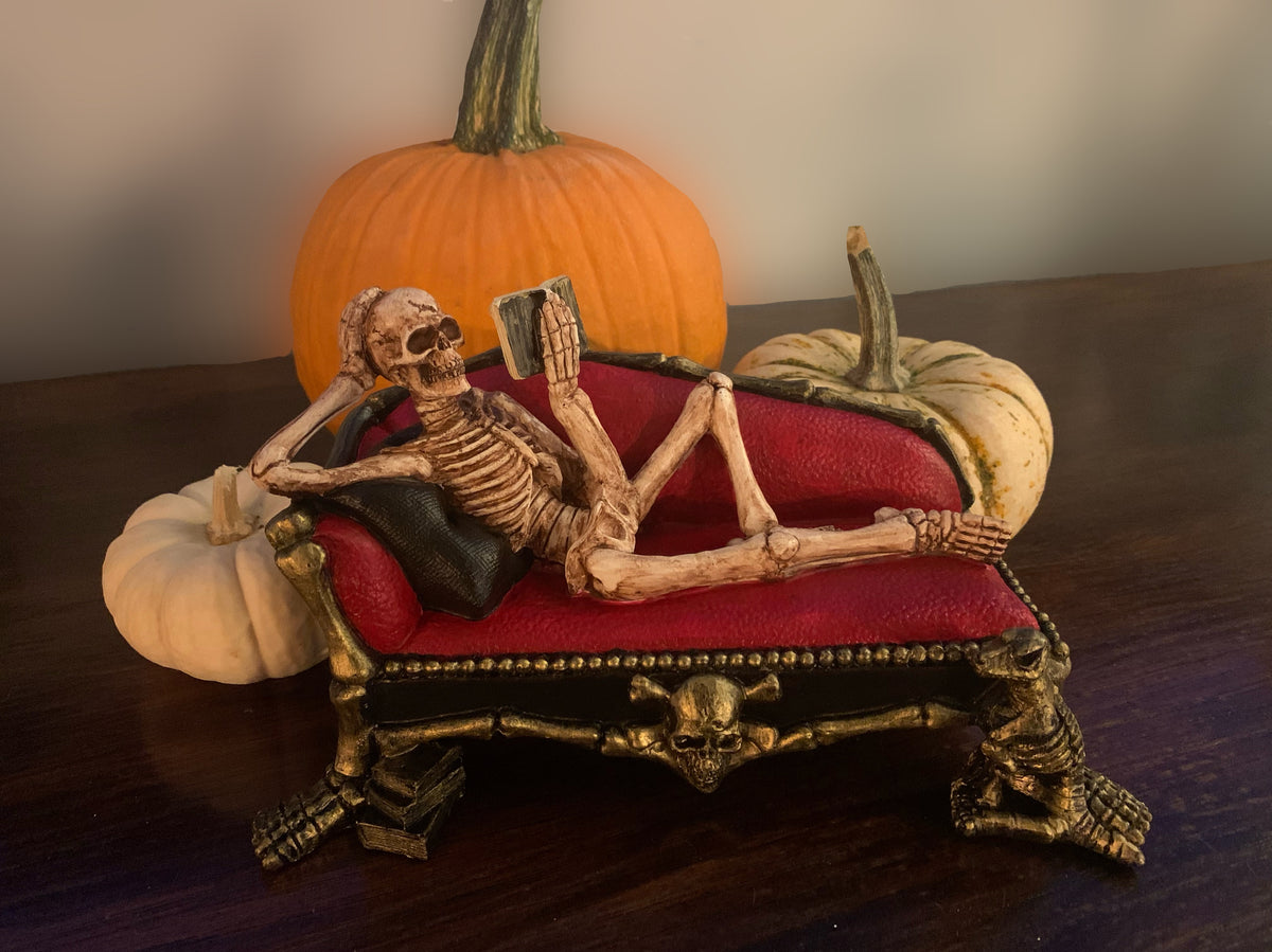 Skeleton on Sofa Reading